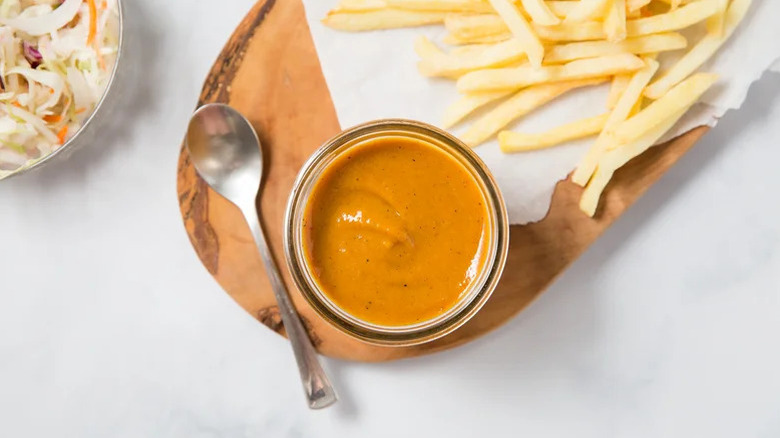 BBQ honey mustard on a table with fries
