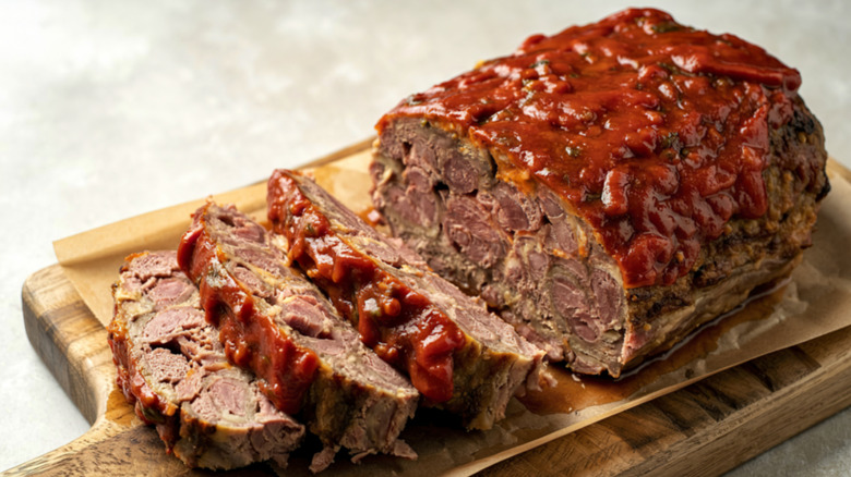 Slices of meatloaf on a wooden cutting board