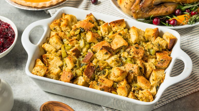 White casserole filled with holiday dressing