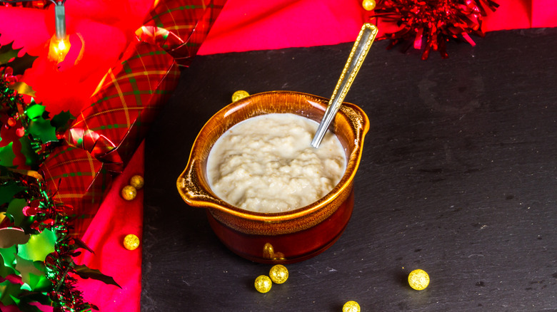 Earthenware pot of bread sauce on a Christmas table