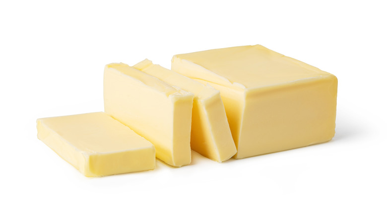 Sliced butter on white background