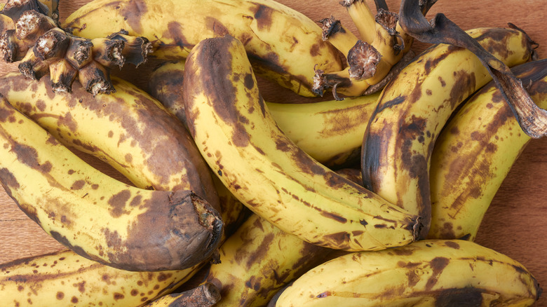 Pile of very ripe bananas on counter