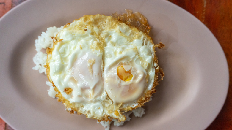 Eggs and white rice on a plate