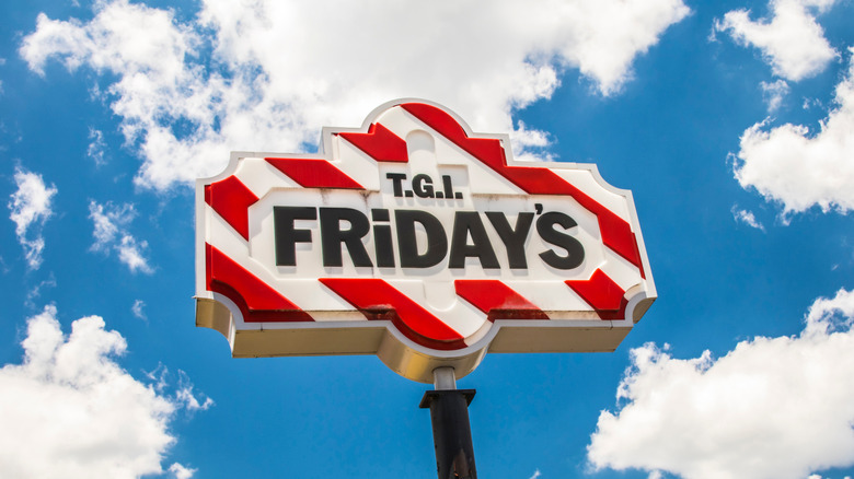 TGI Friday's restaurant sign against cloudy sky