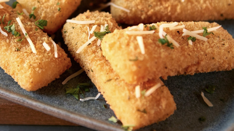 Mozzarella sticks on plate