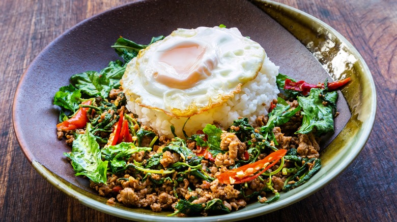 A plate of pad kra pao with rice