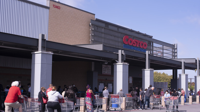 People lined up outside of Costco