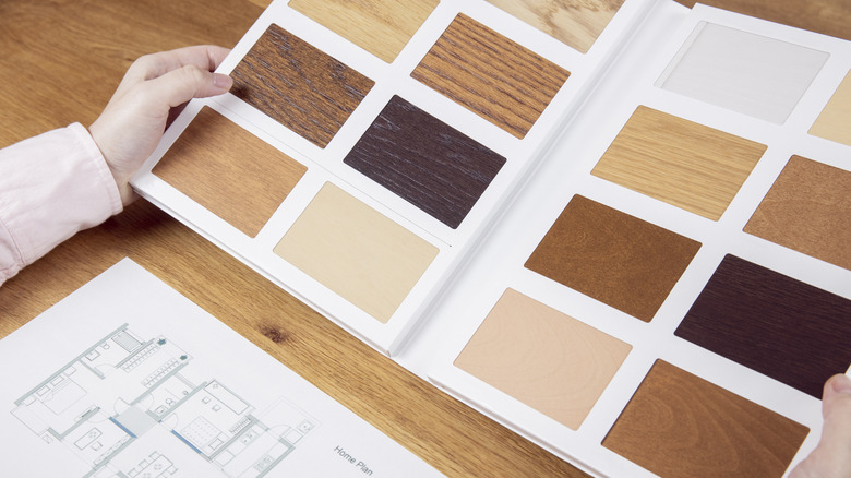 A woman choosing from wooden samples