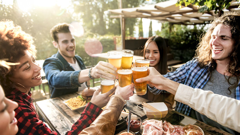 Young group of friends enjoy brewery drinks