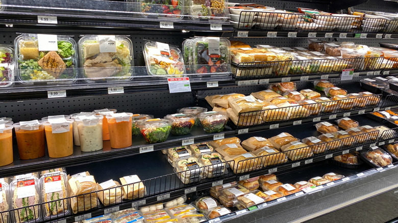 Display of pre-made salads and food at Publix.