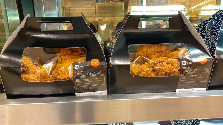 Publix fried chicken on a warming shelf.