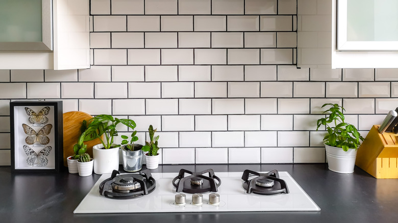 Kitchen counter with stove and backsplash