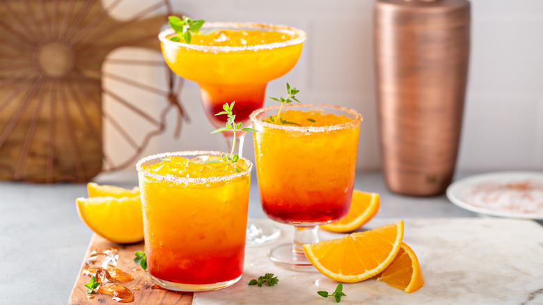 Tequila Sunrise cocktails in various glassware