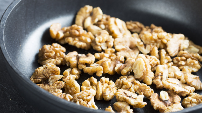 Close up bowl of toasted walnuts