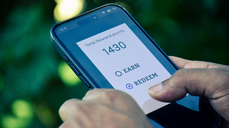 Someone looking at their reward points on a phone screen