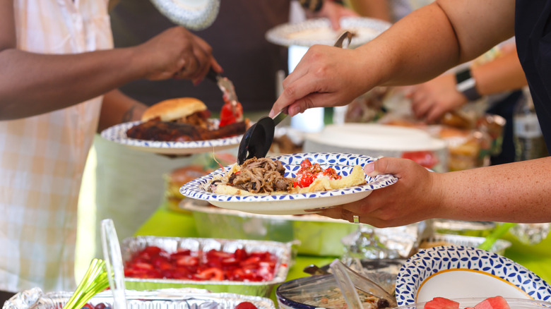 Serving a plate with barbecue and fruit