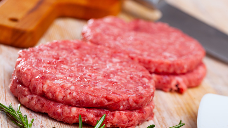 Raw flat hamburger patties