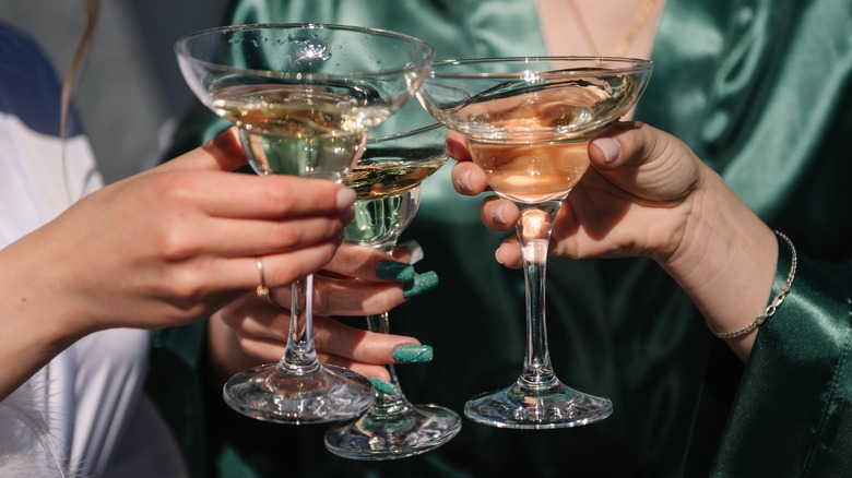 friends cheers with martinis