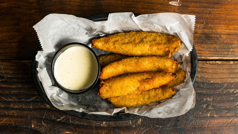 Basket of fried pickle spears with ranch