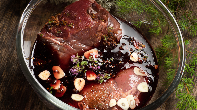Game meat marinating in red wine