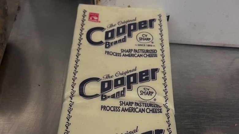 Squares of of Cooper Sharp cheese in its packaging