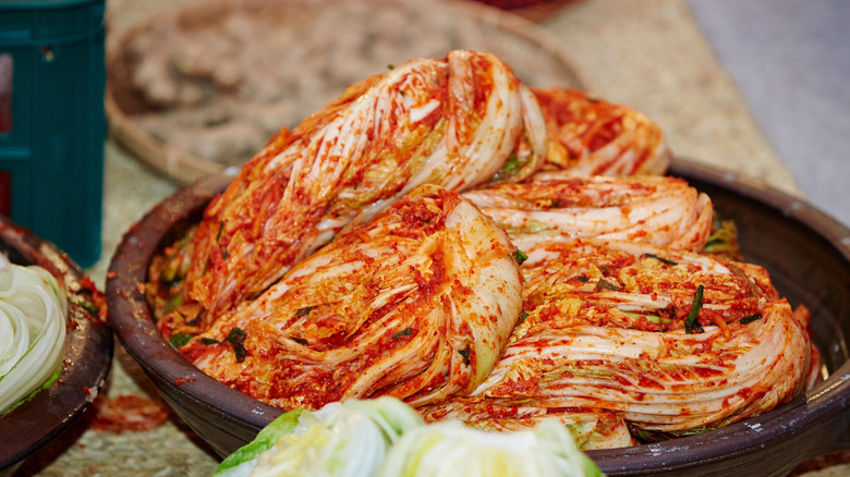 Traditional Korean kimchi in a wooden bowl