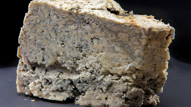 A large wedge of Cabrales cheese