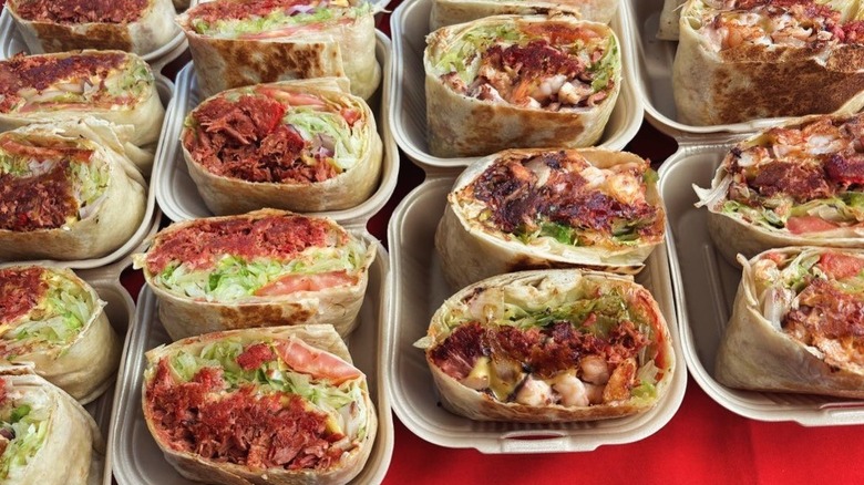 Trays of burritas de mariscos at Tacón de Marlin in Puerto Vallarta