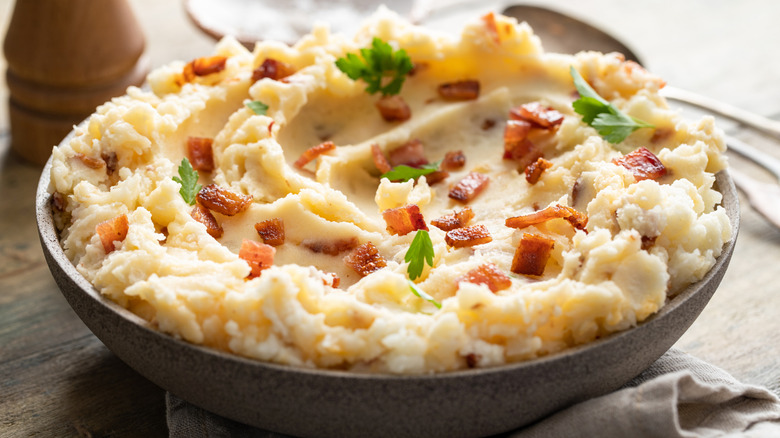 Bacon mashed potatoes in a rustic serving bowl