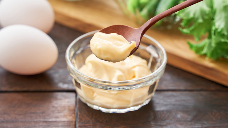 Homemade mayonnaise in a small glass bowl