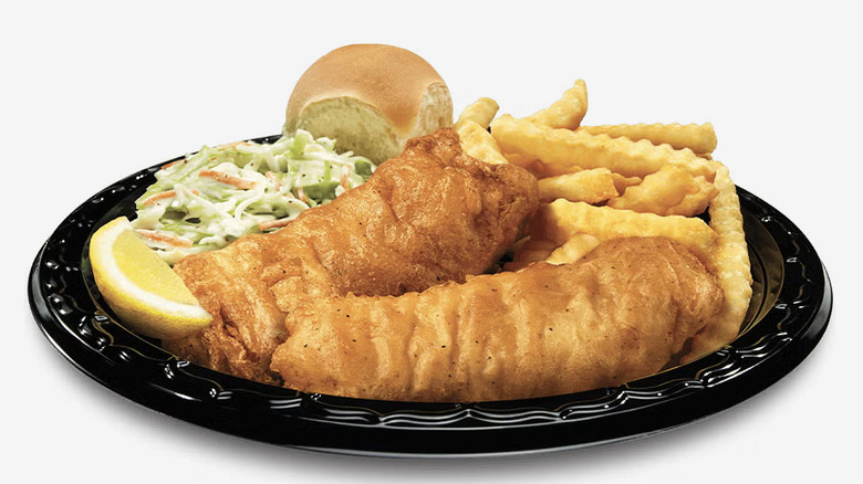 A Culver's fish fry features fried fish, crinkle cut fries, coleslaw, and a dinner roll.