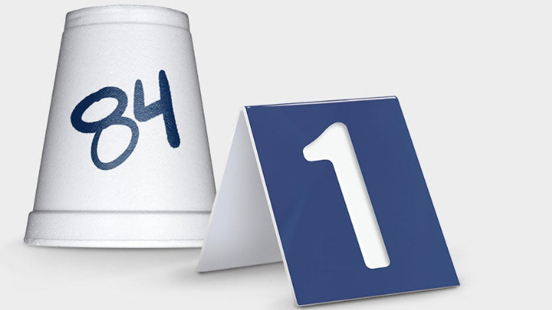 A styrofoam cup sits next to a Culver's table tent.