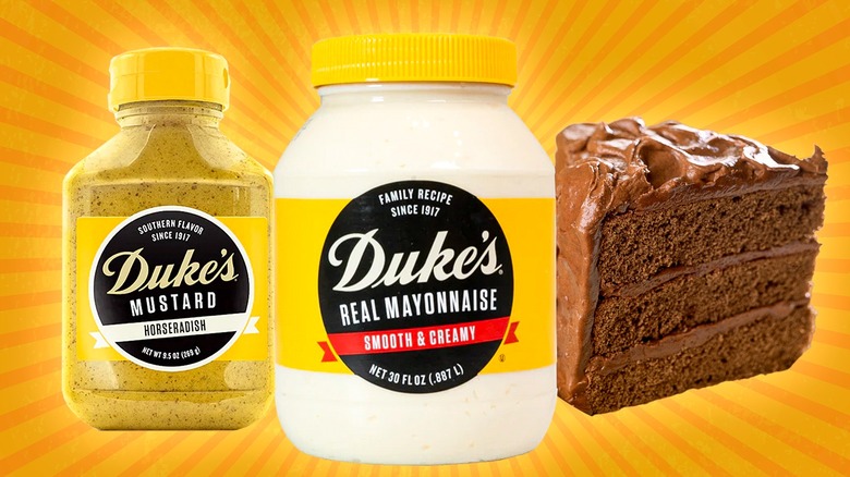 Duke's Mayo jar, Duke's mustard bottle, and a slice of frosted chocolate cake