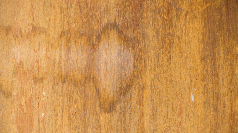 A wood surface with water stains