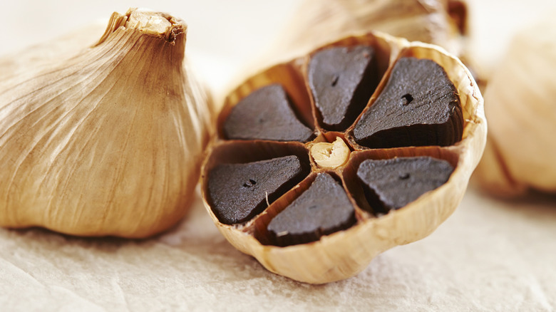 Jammy black garlic clove half