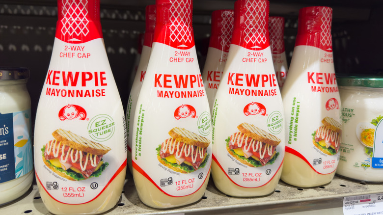 Bottles of Kewpie mayo on a grocery store shelf