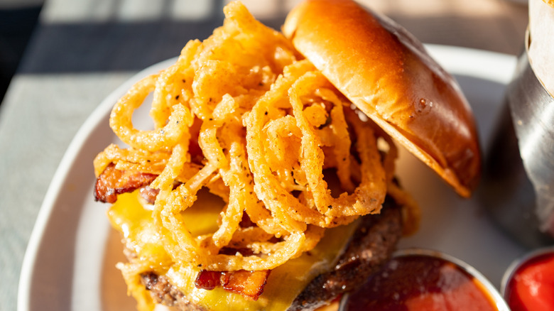 Burger topped with onion rings