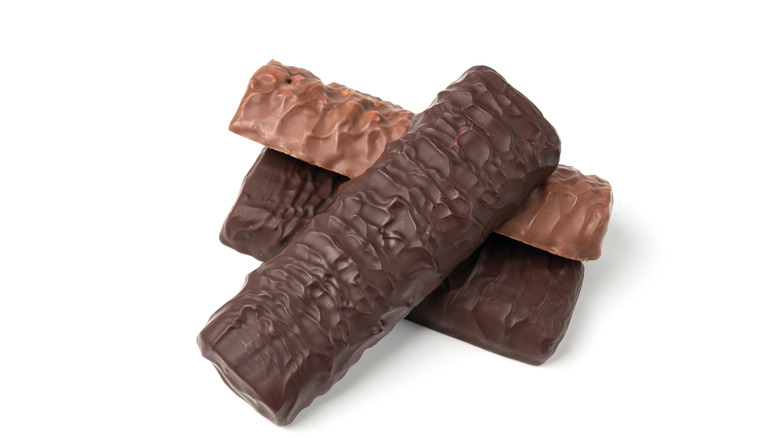 Three chocolate covered breakfast bars on a white background