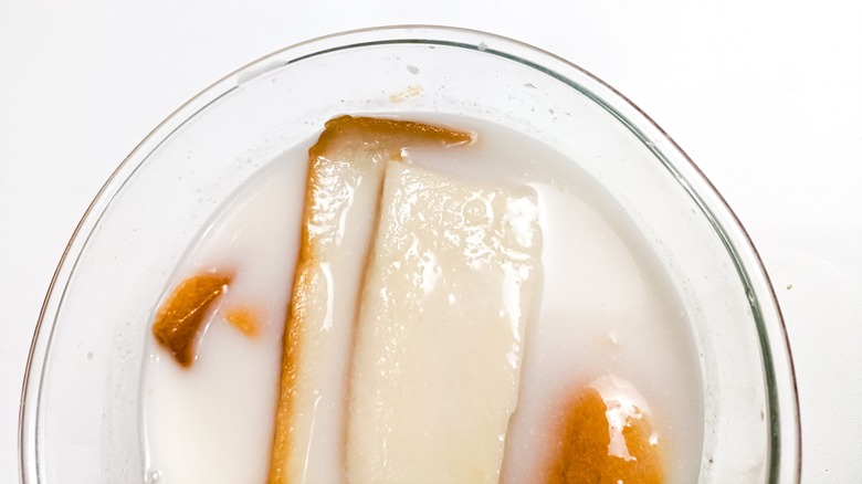 Pieces of toast in a bowl of milk