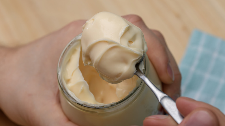 Close up of a spoonful of creamy mayonnaise