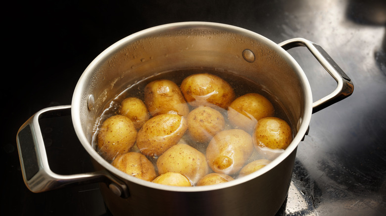 Potatoes being cooked in a pot of water