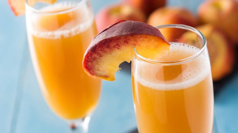 Bellini glass with fruit wedge garnish