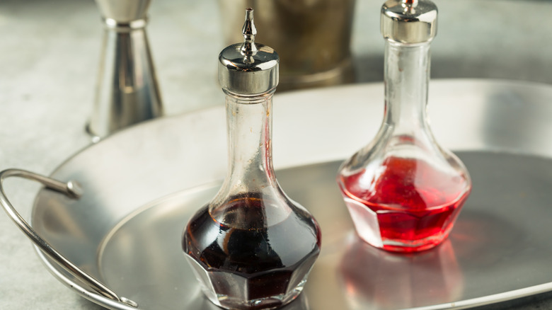 Bottles of alcoholic bitters on silver tray