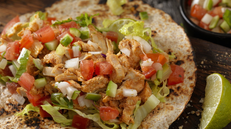 Chicken tacos with peppers and onions