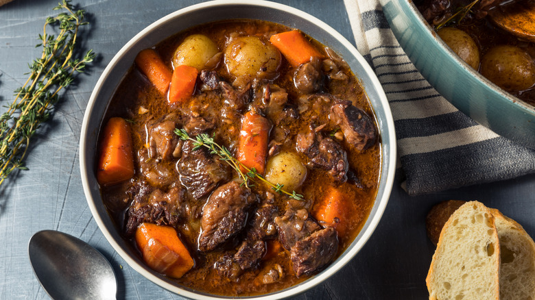 Pot of homemade beef stew with carrots and potatoes