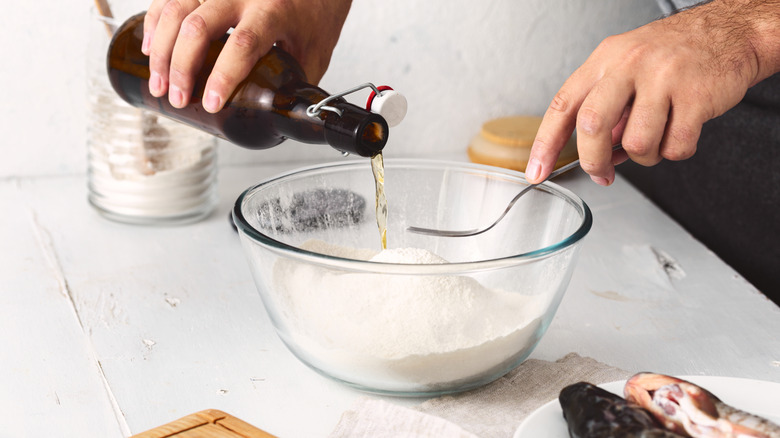 Person preparing a beer batter for fish