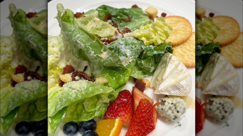Salad with creamy dressing, bacon, and Ritz Crackers