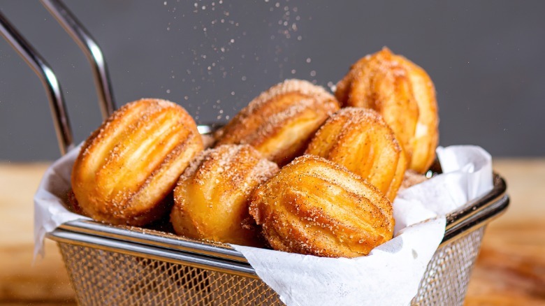 Wire basket filled with churro bites