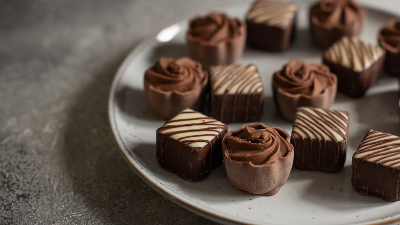 Fancy chocolate truffles on plate