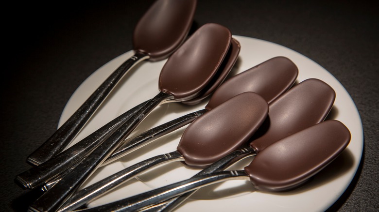 Spoons coated in chocolate
